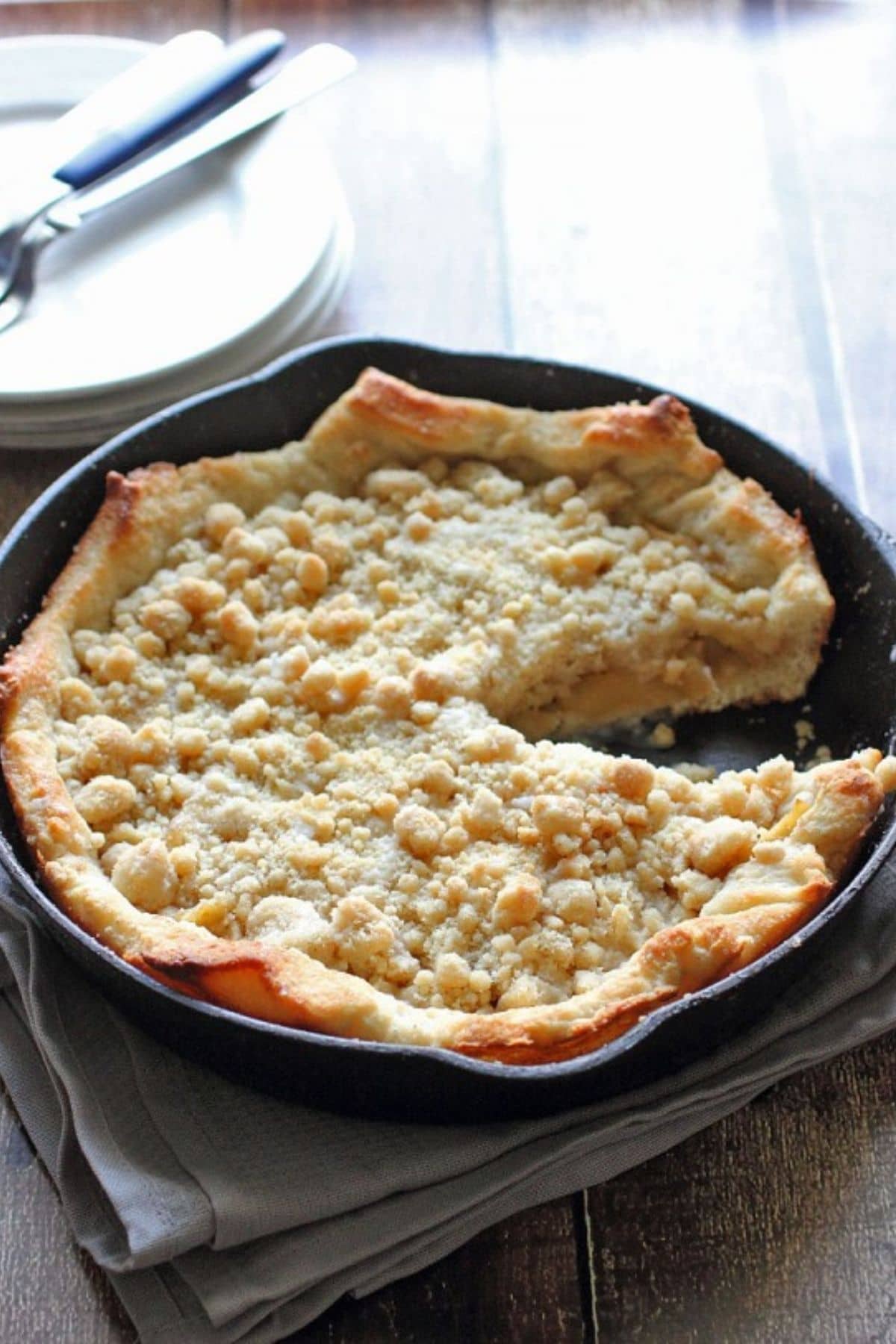 apple pie in cast iron skillet on table