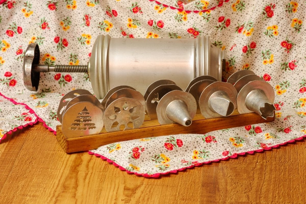 Vintage cookie press on wooden table