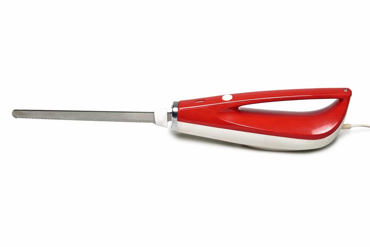 Electric fillet knife on a white background.