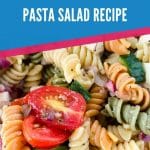 Close up photo of colorful rotini pasta salad with blue and pink overlay that says mediterranean pasta salad recipe