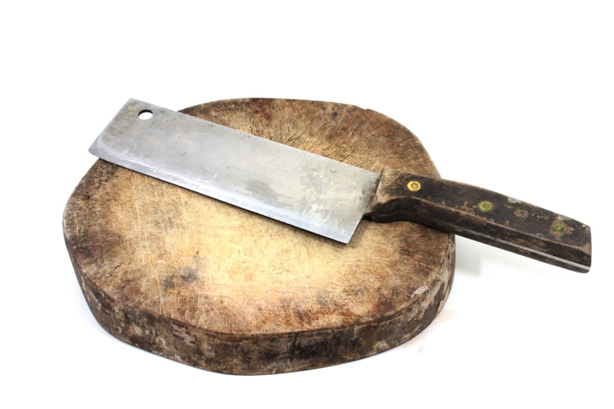 Chinese cleaver on a wooden board.