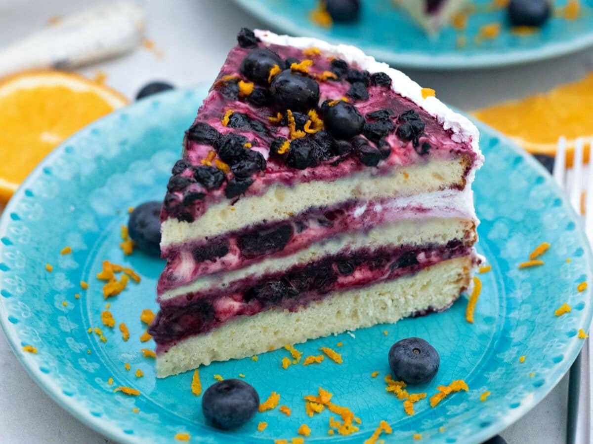Blueberry cake on teal plate