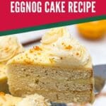 Slice of cake on cake server with red banner overlay that says orange spice eggnog cake recipe