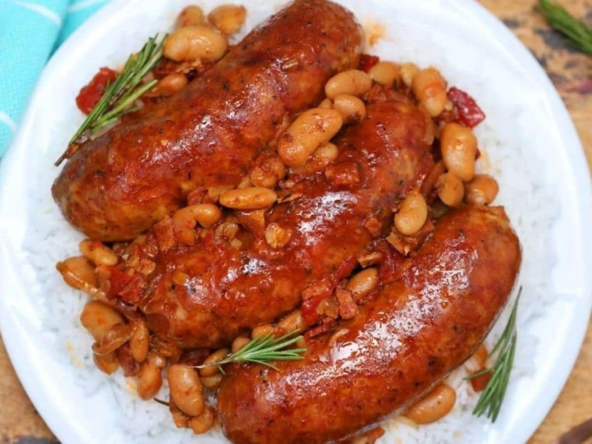 sausage and beans on white plate
