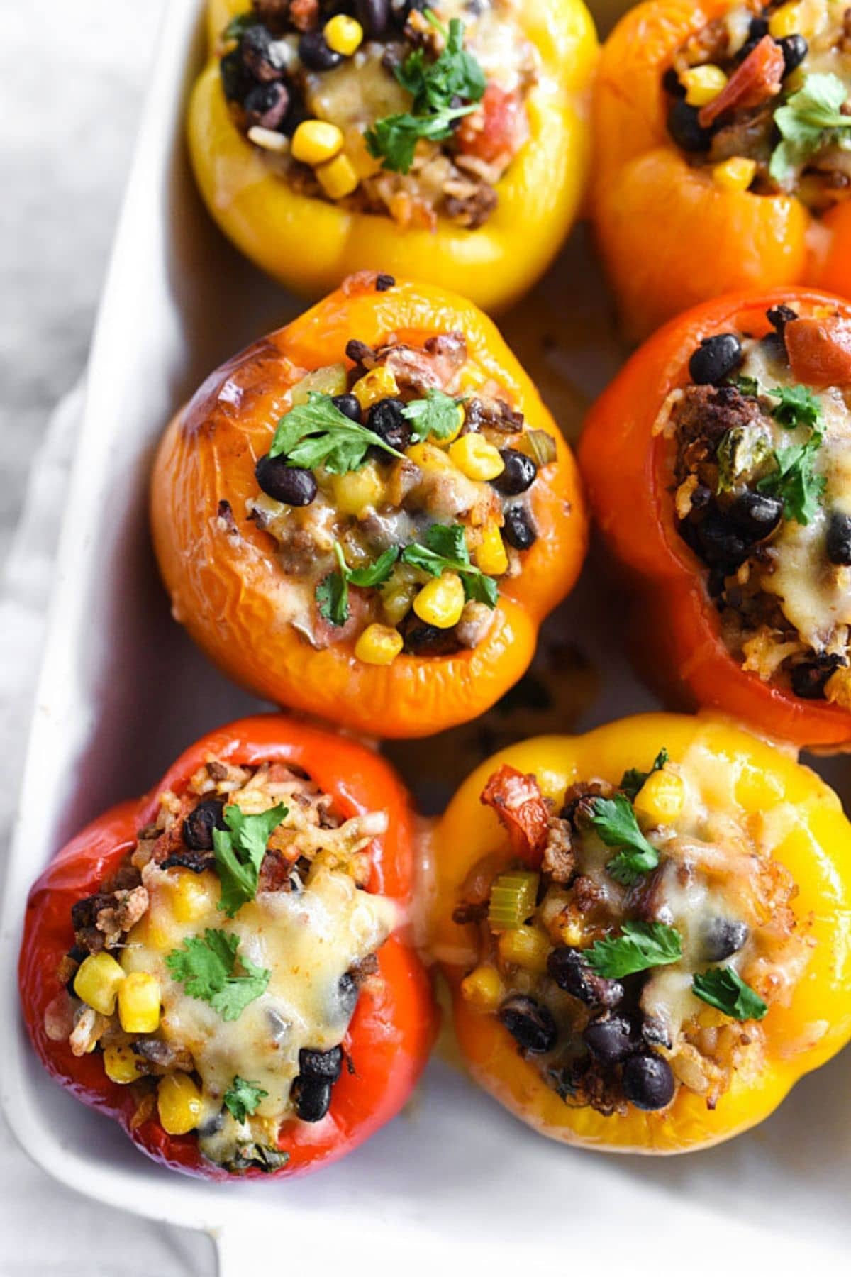 stuffed bell peppers in white dish