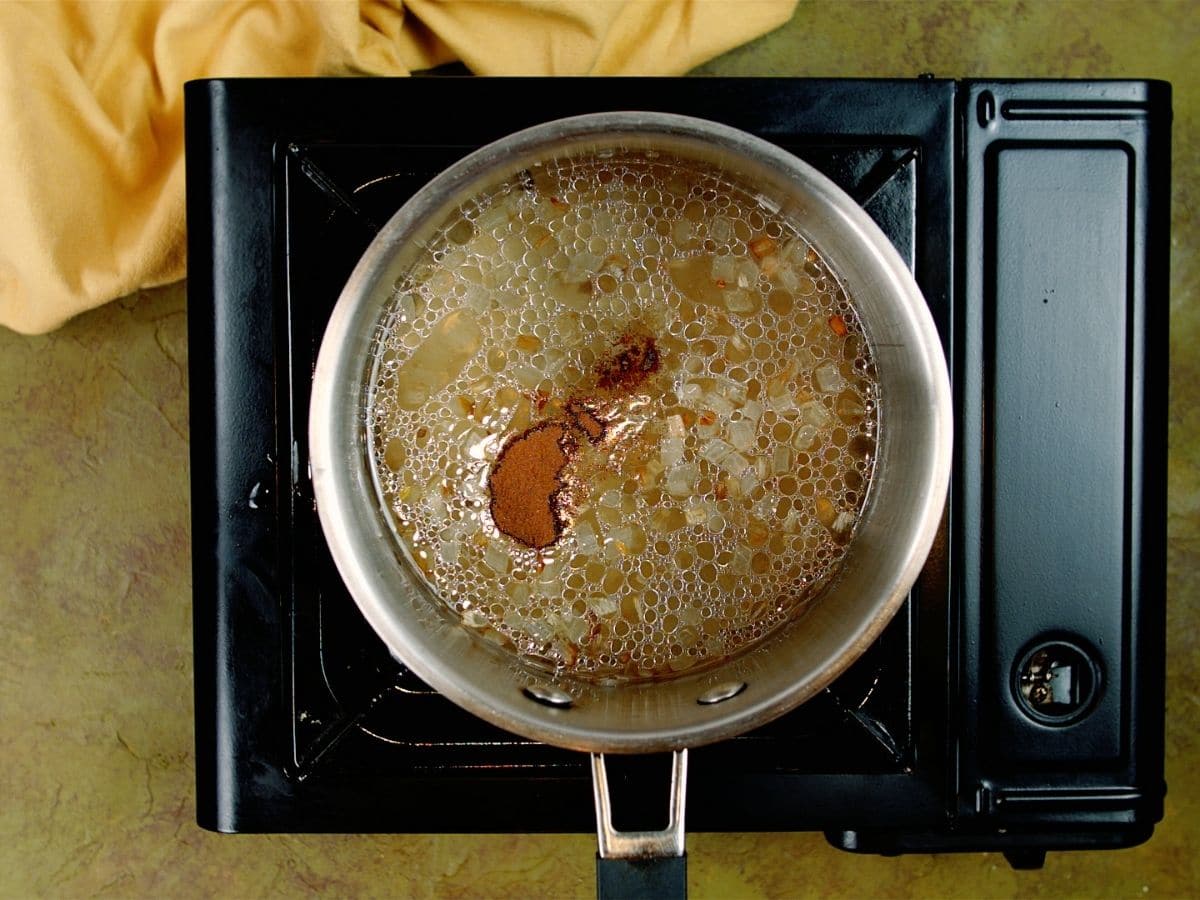 Broth in saucepan on hot plate
