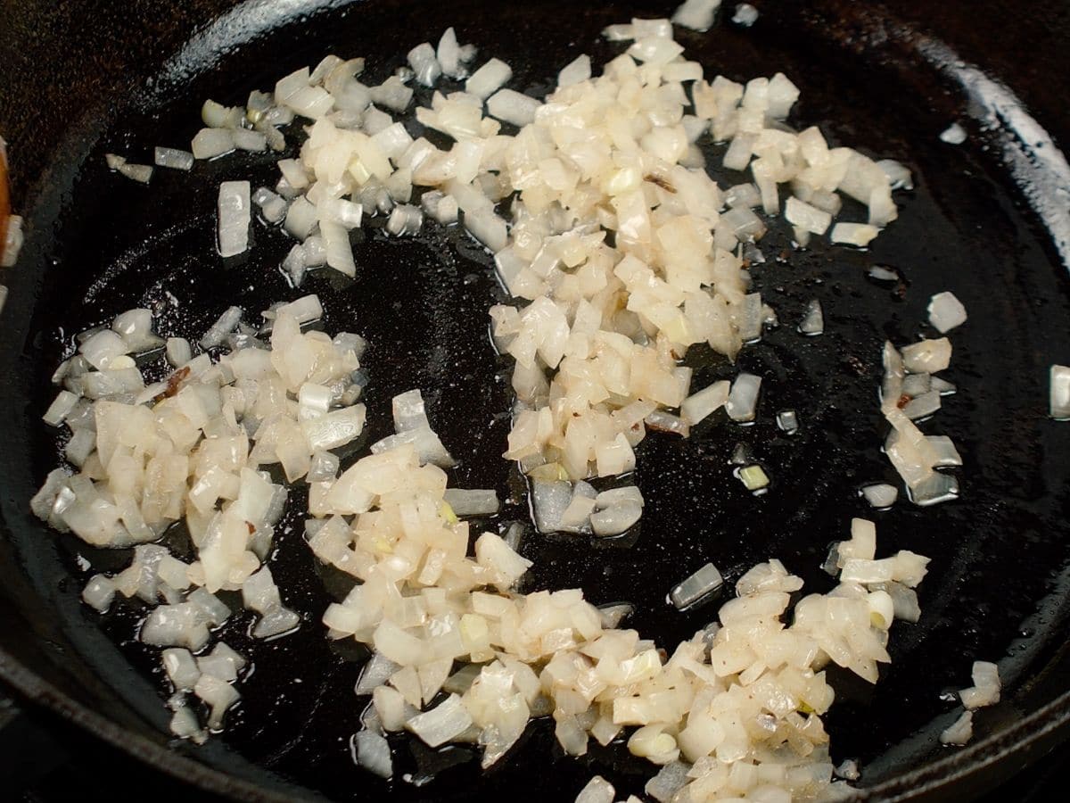 Chopped onions in cast iron skillet