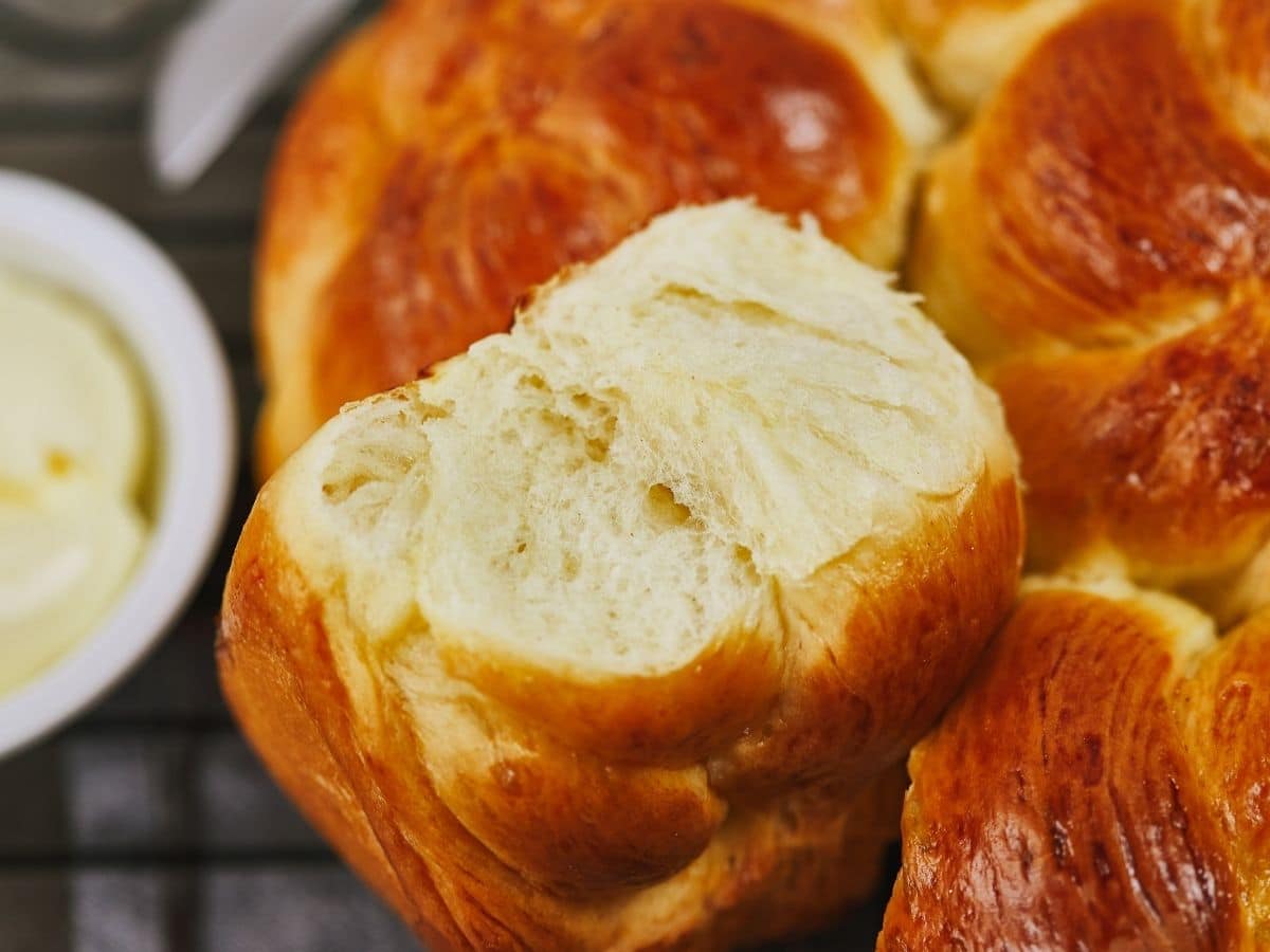 milk bread knot roll apart from other rolls showing soft inside