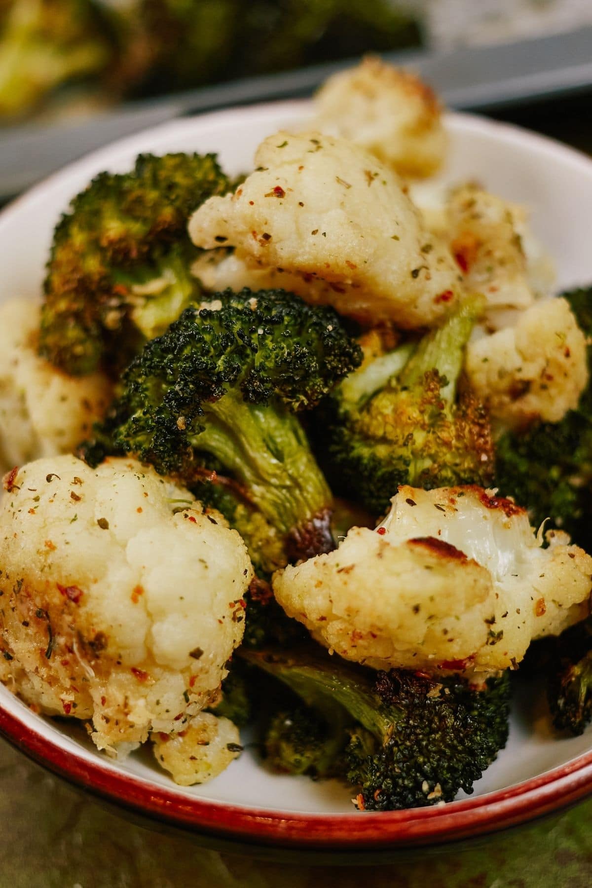 White bowl of broccoli and cauliflower