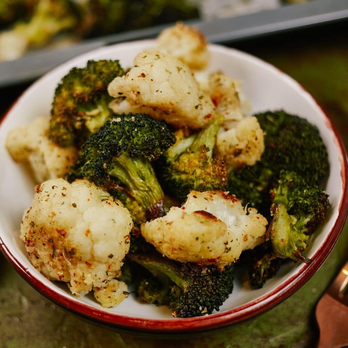 White bowl of broccoli and cauliflower
