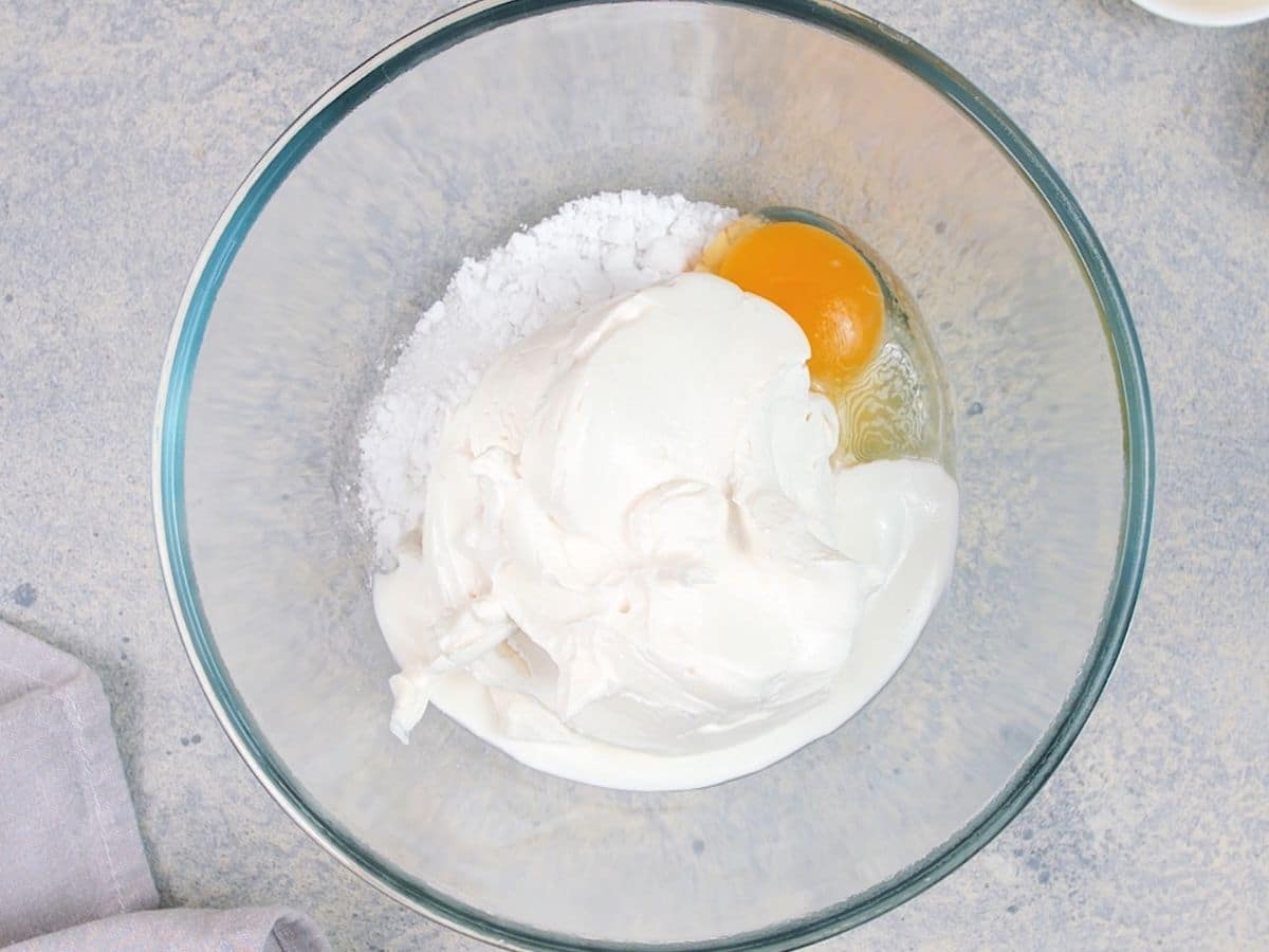 Cream cheese and egg in large glass bowl