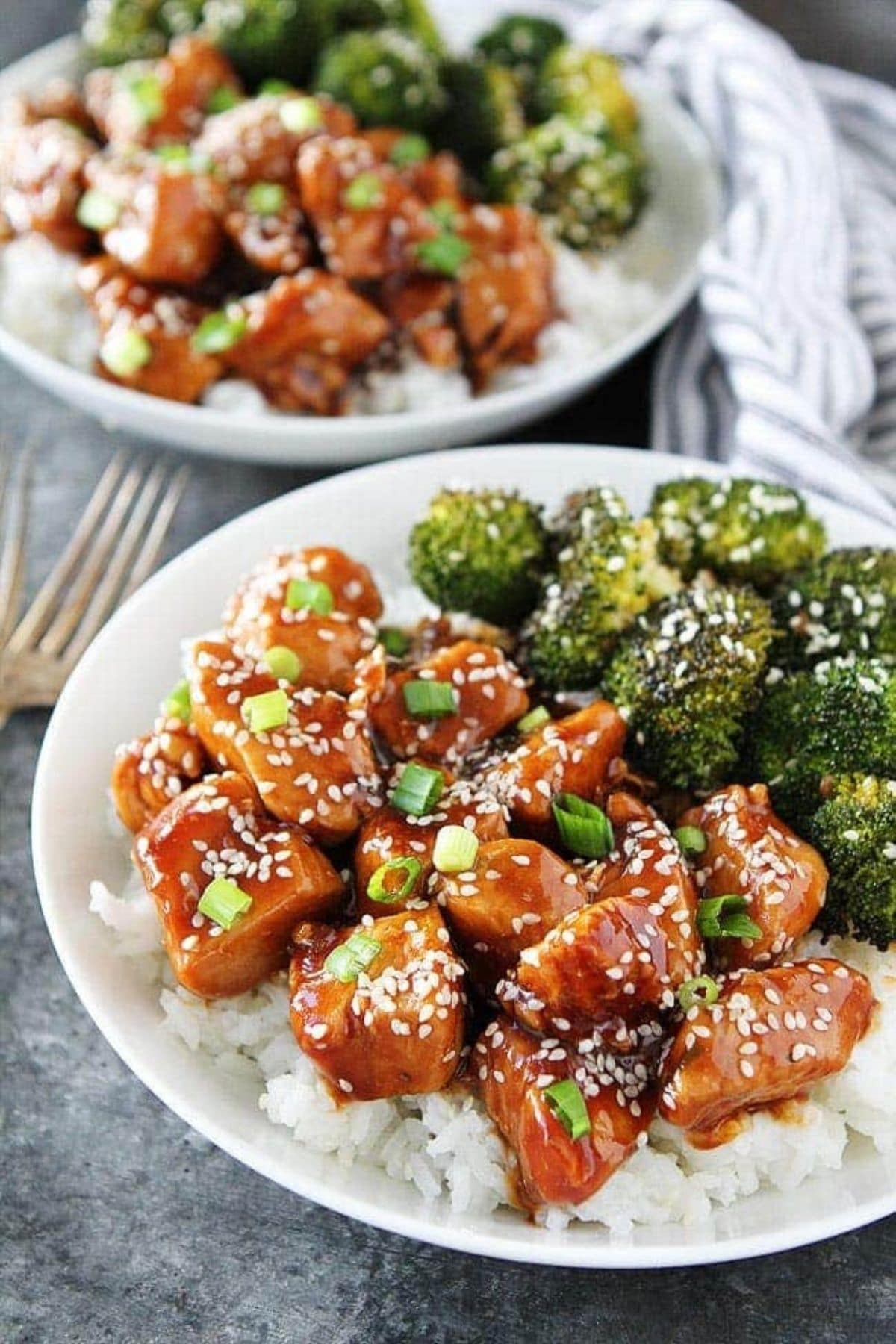 sesame chicken rice and broccoli on white plate
