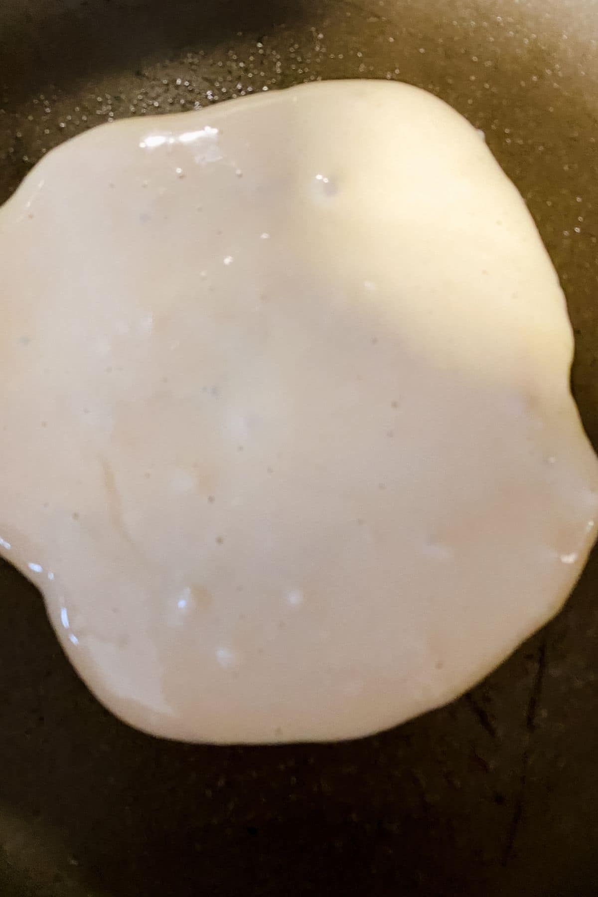 pancake batter in skillet