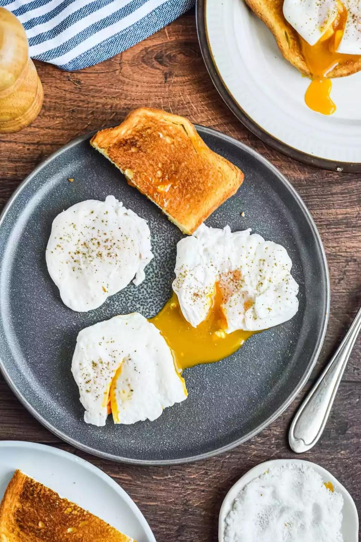 eggs and toast on gray plate