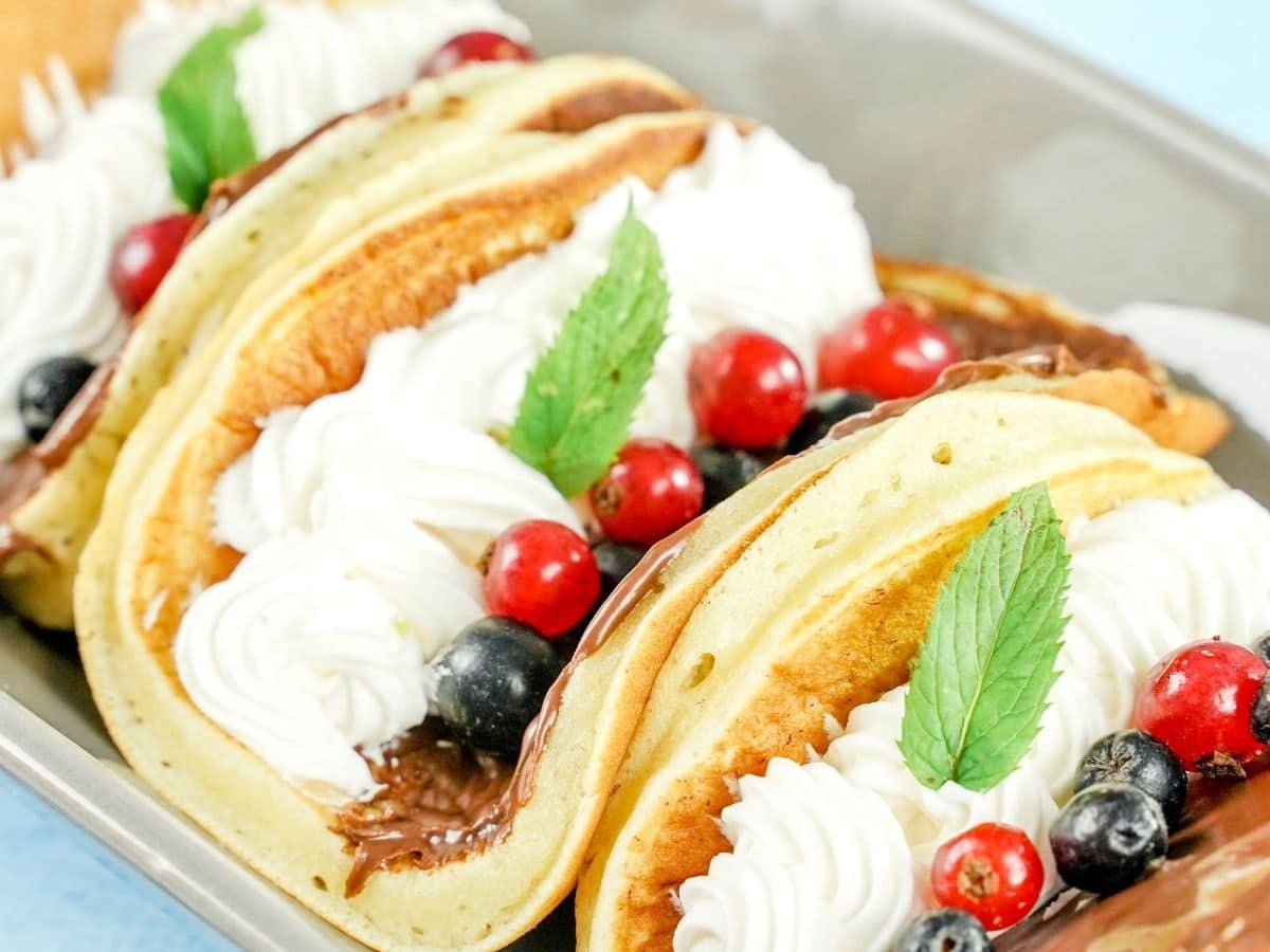 pancackes stuffed with berries and cream