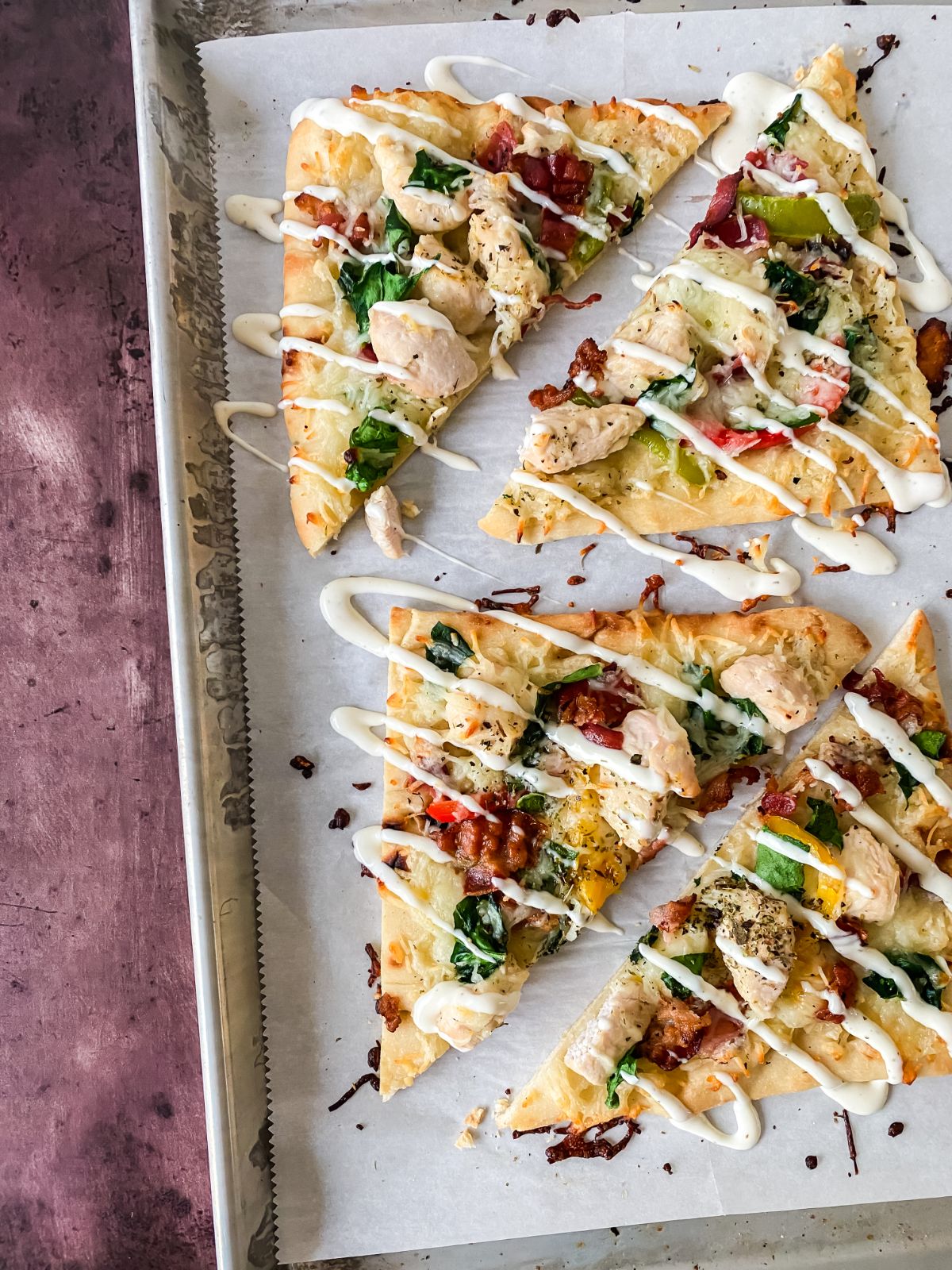 baking sheet with flatbread pizza slices