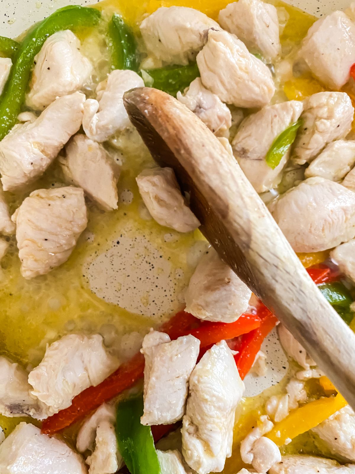 cooked chicken and peppers in skillet