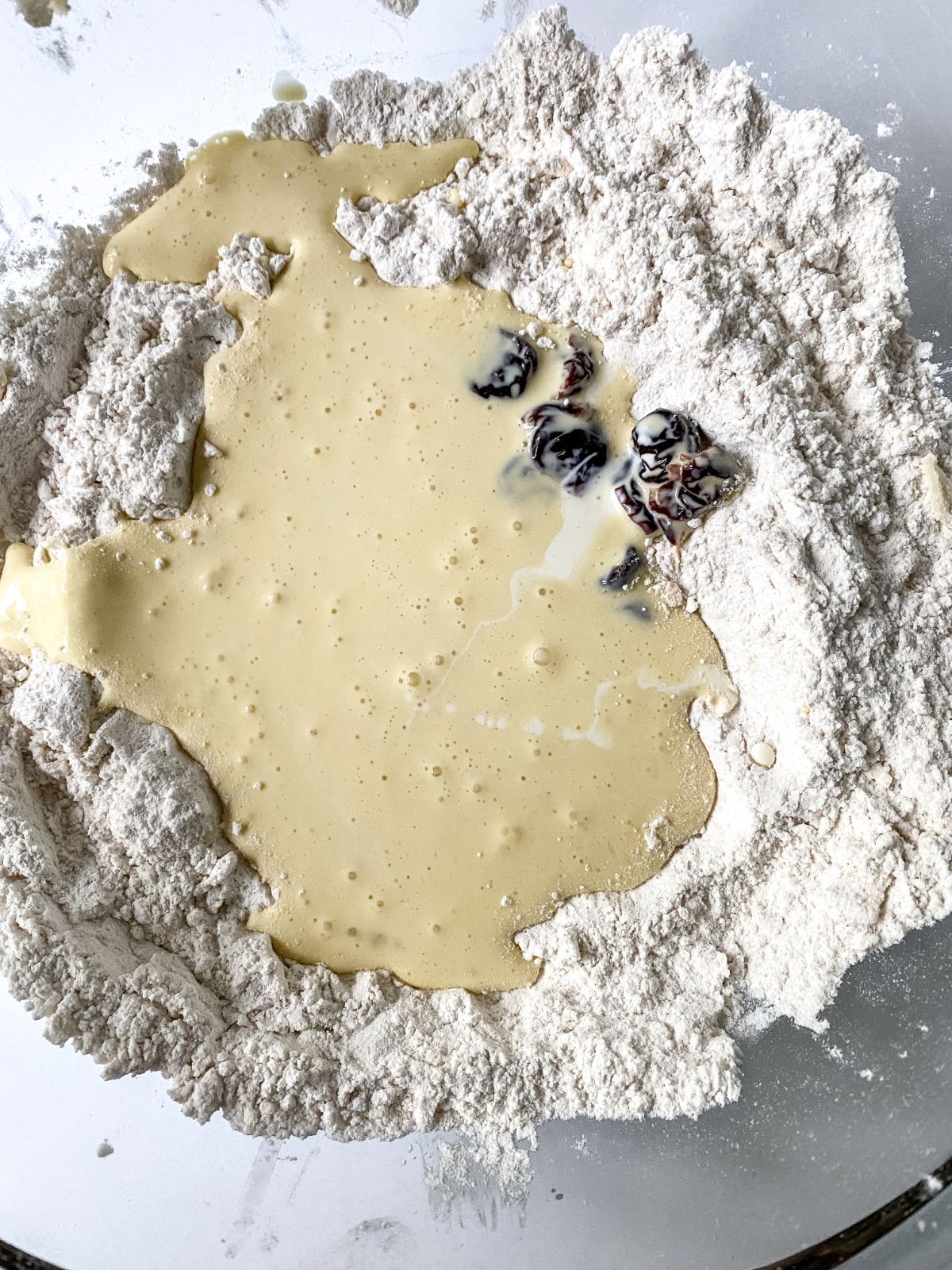 wet ingredients in middle of flour in bowl