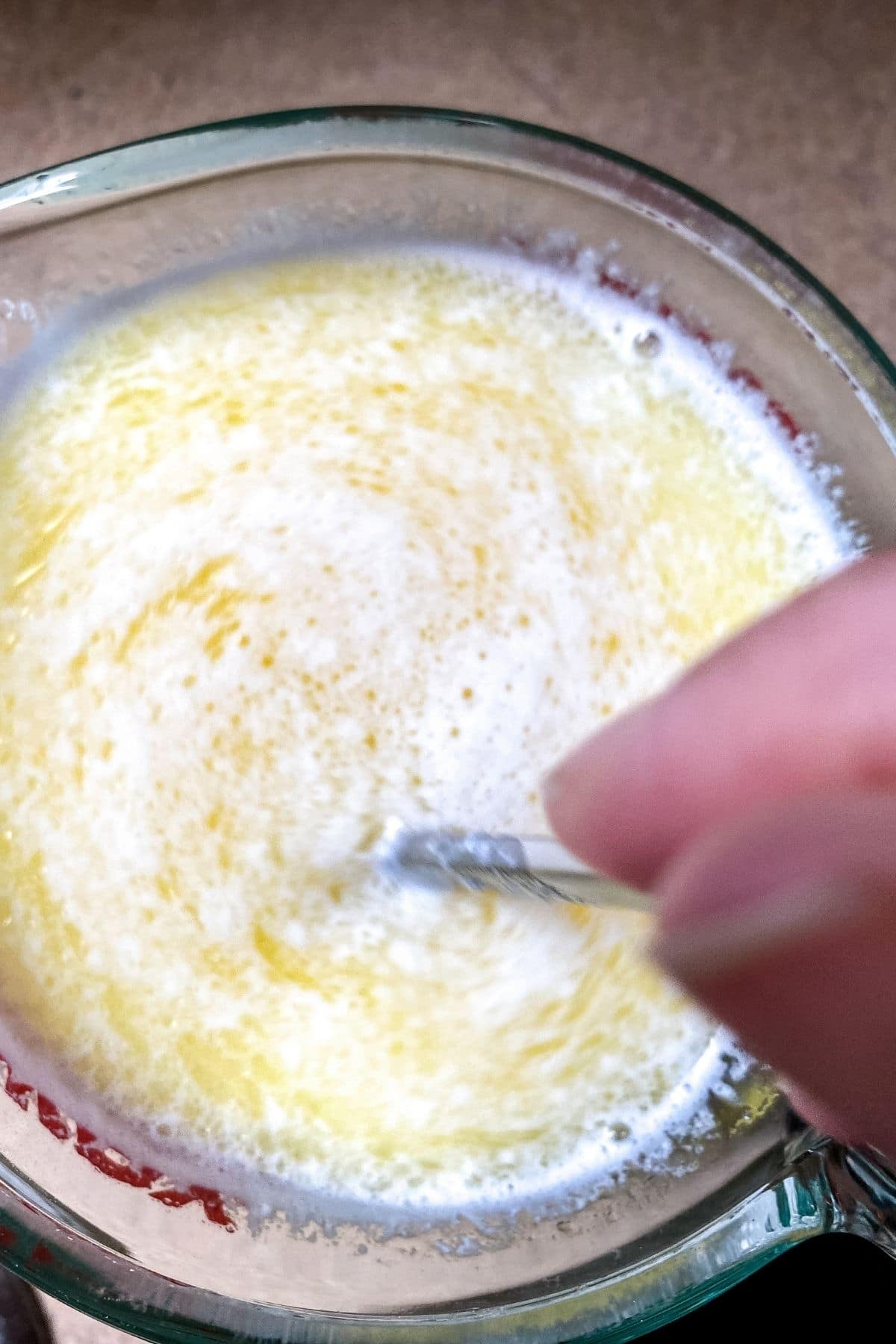 melted butter and milk in measuring cup