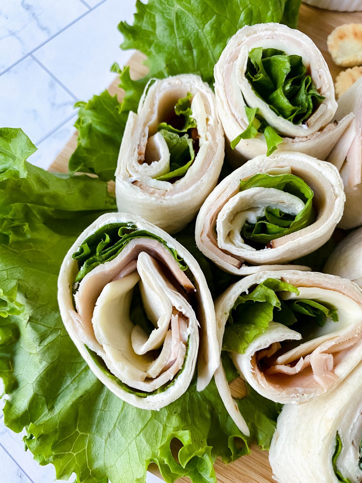 turkey and cheese pinwheels on lettuce