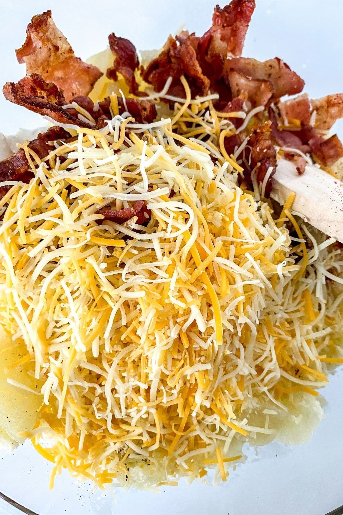 glass bowl of cheese and bacon