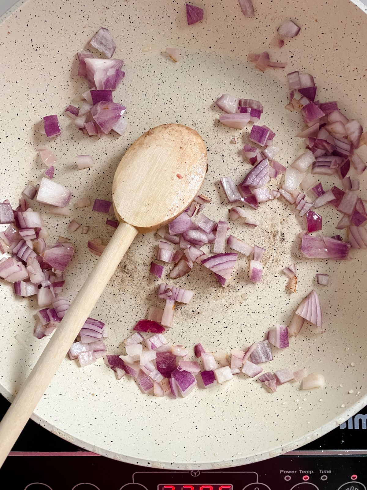 red onions in white skillet