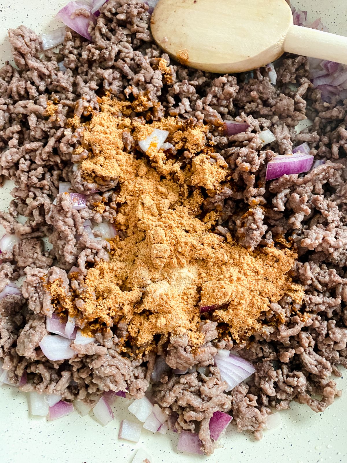 cooked ground beef topped with taco seasoning