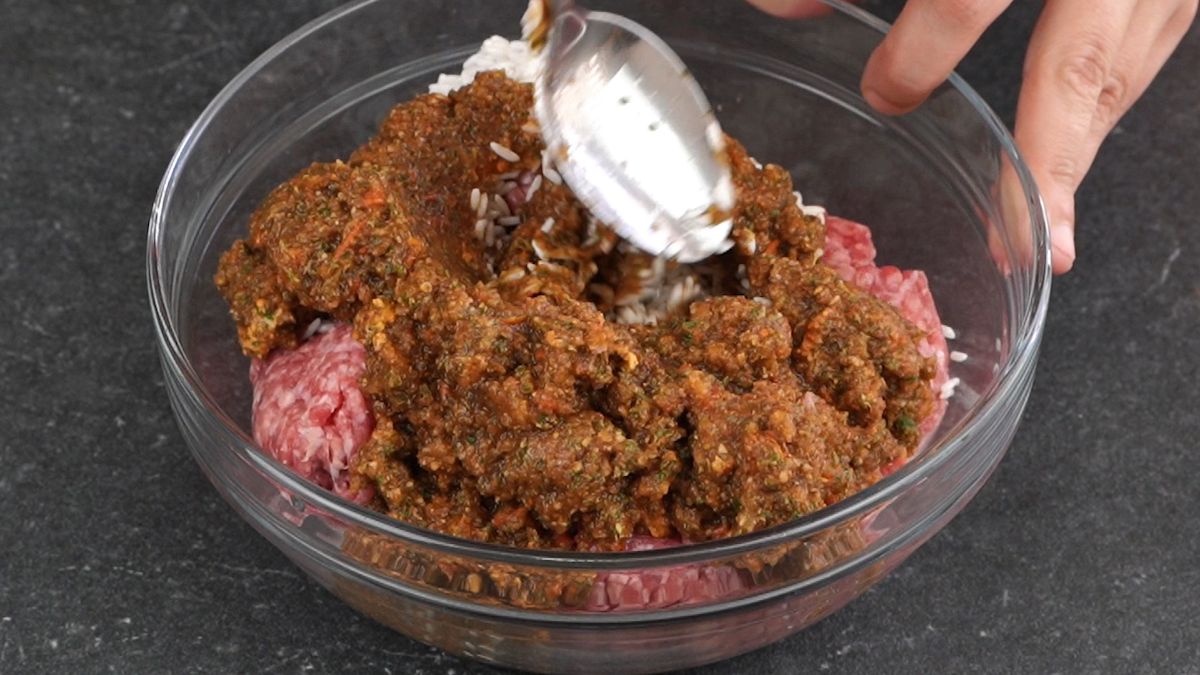 glass bowl of ground meat and tomato sauce