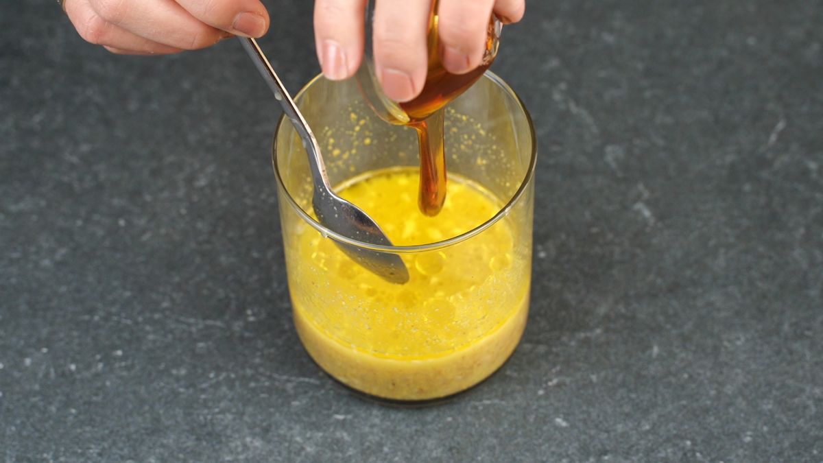 glass jar of honey mustard with spoon