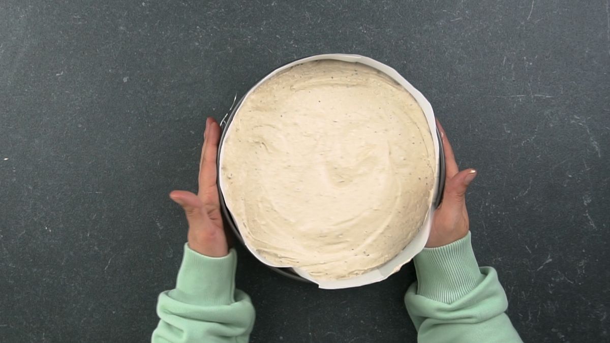 springform pan of cheesecake before baking