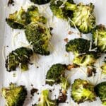 roasted broccoli with cheese on sheet pan with parchment paper