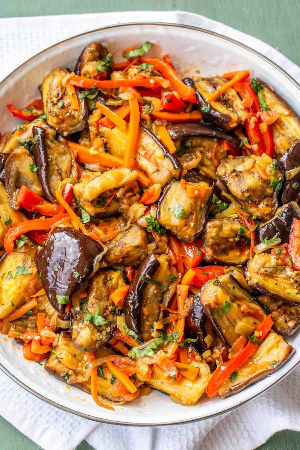 roasted colorful eggplant in large white bowl