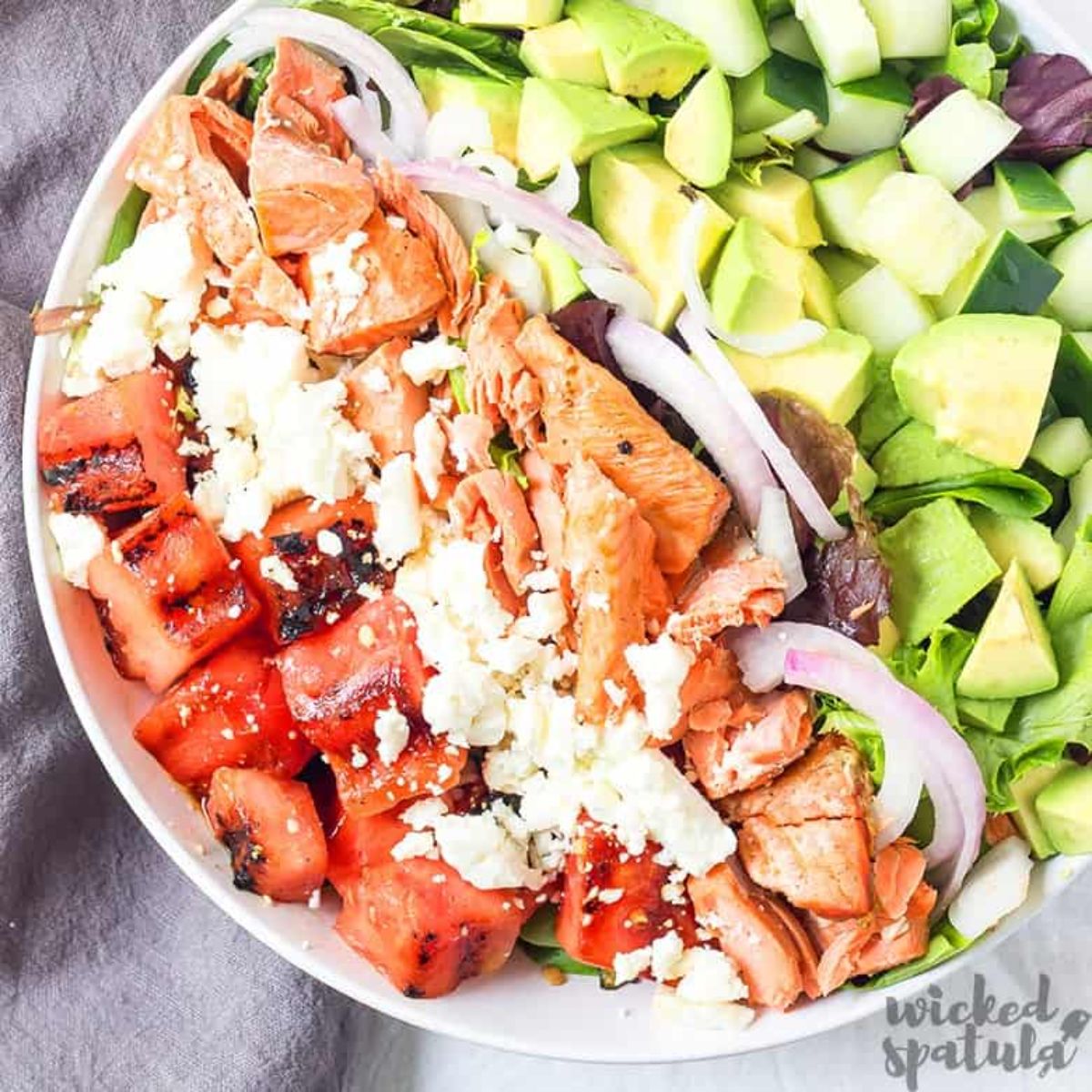 salmon water and avocado in white bowl