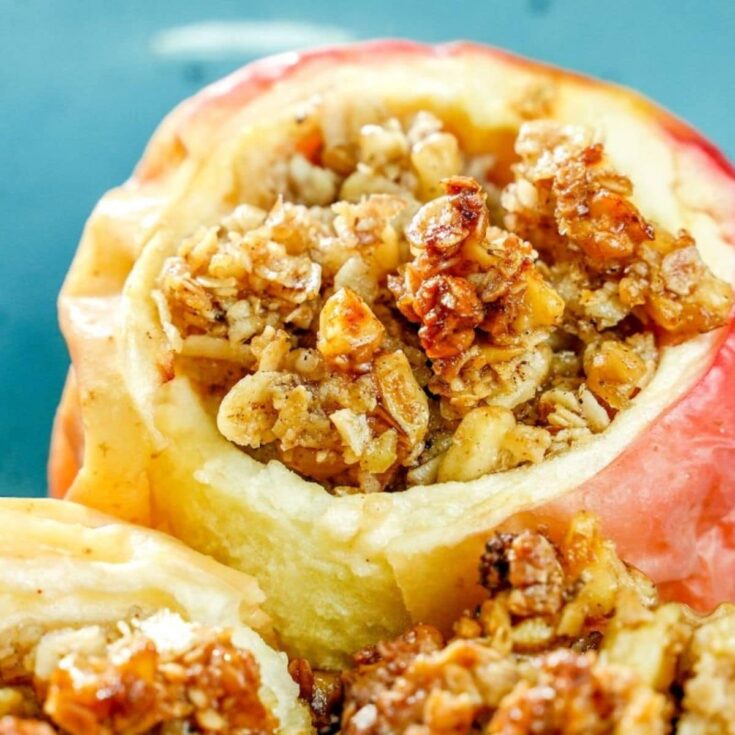 close up image of baked apple with oatmeal top