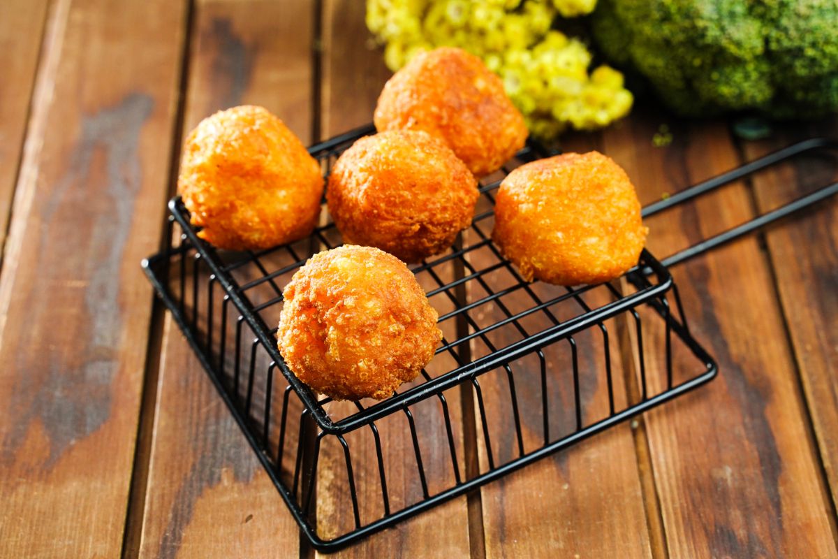 wire basket with cheese boulders on top