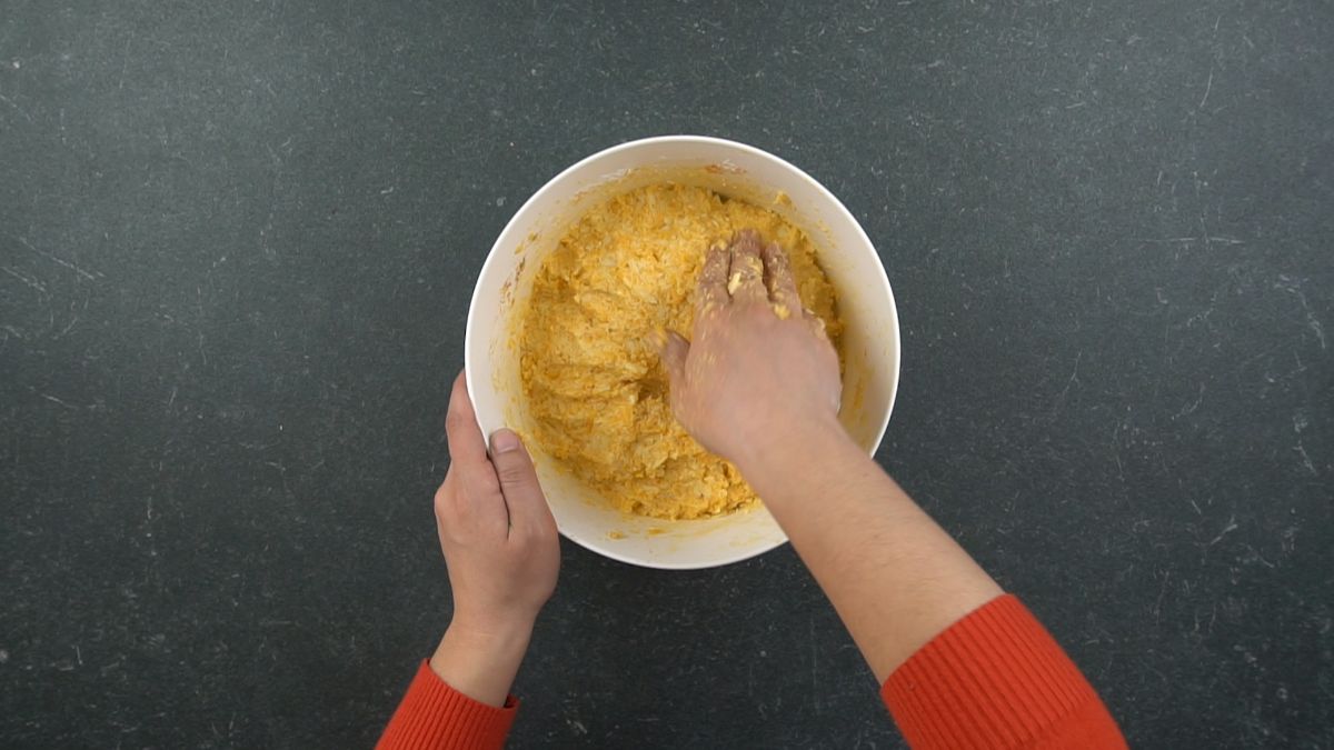 hand mixing cheese ball mixture