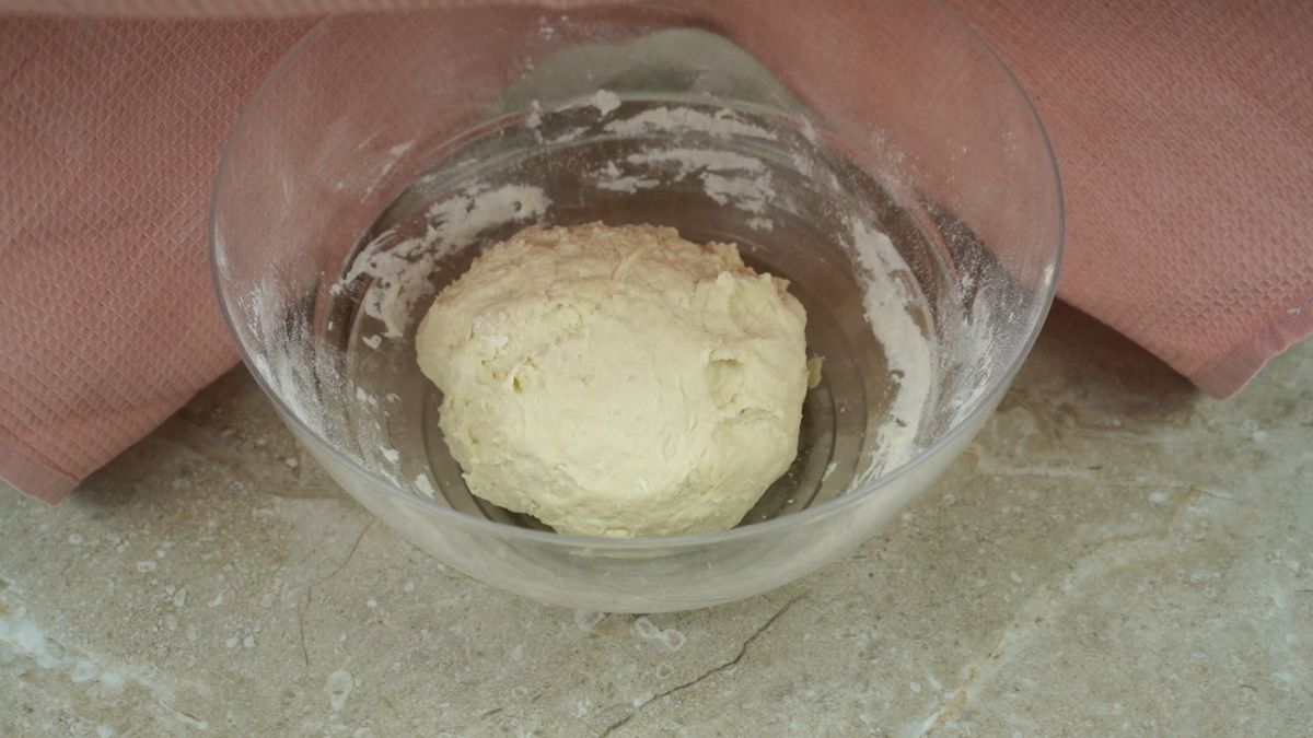 ball of dough in glass bowl