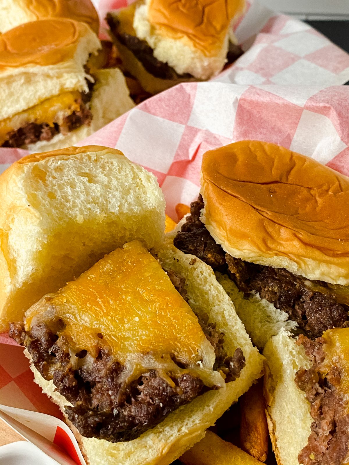 close up picture of sliders with cheese