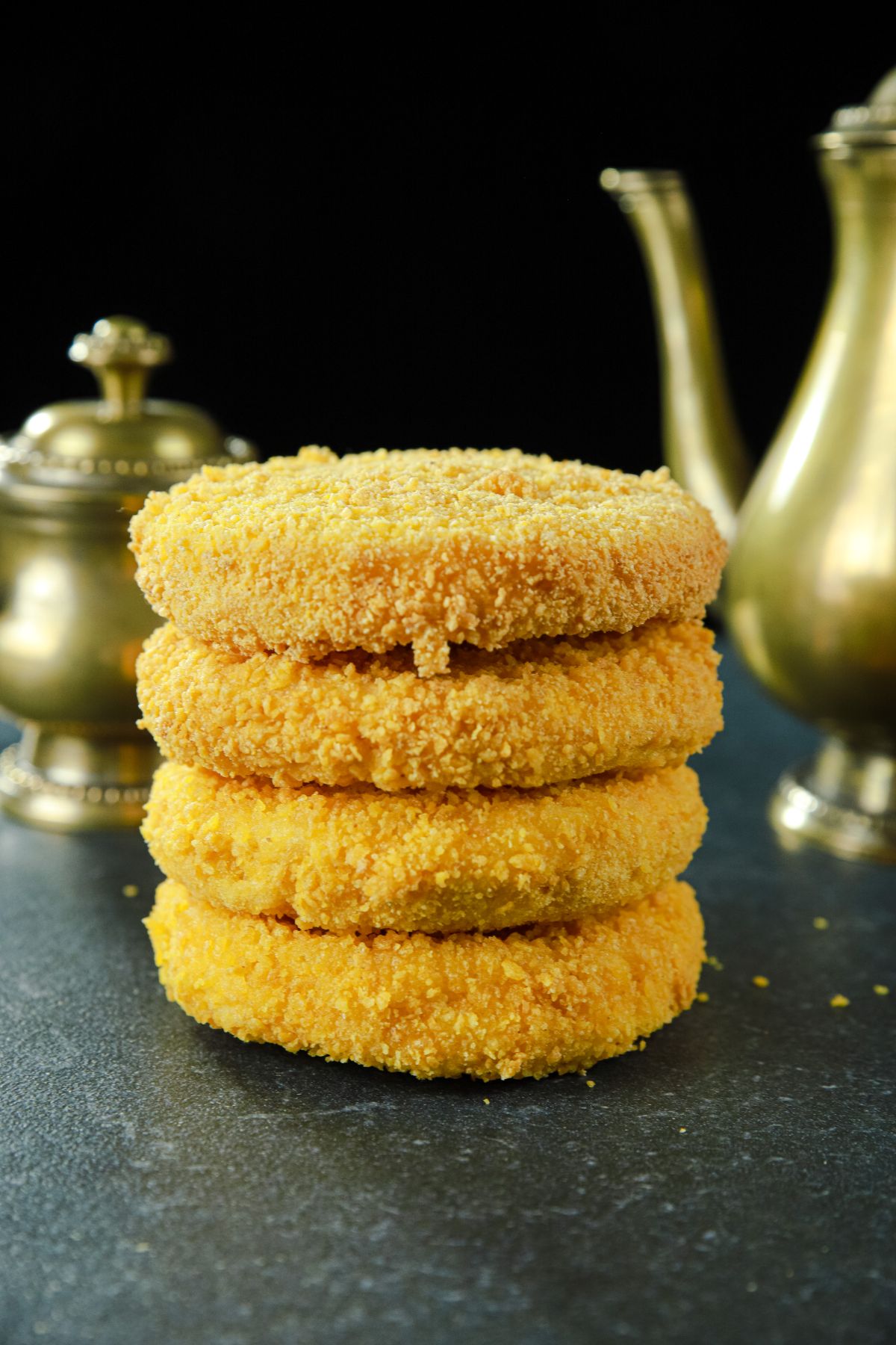 stack of fried bread on black table