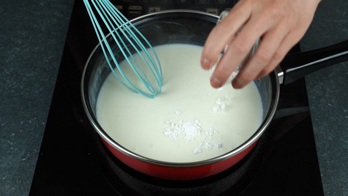 teal whisk in milk and chocolate mixture