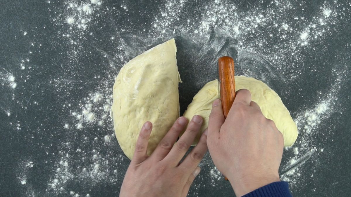 bench scraper cutting dough in half
