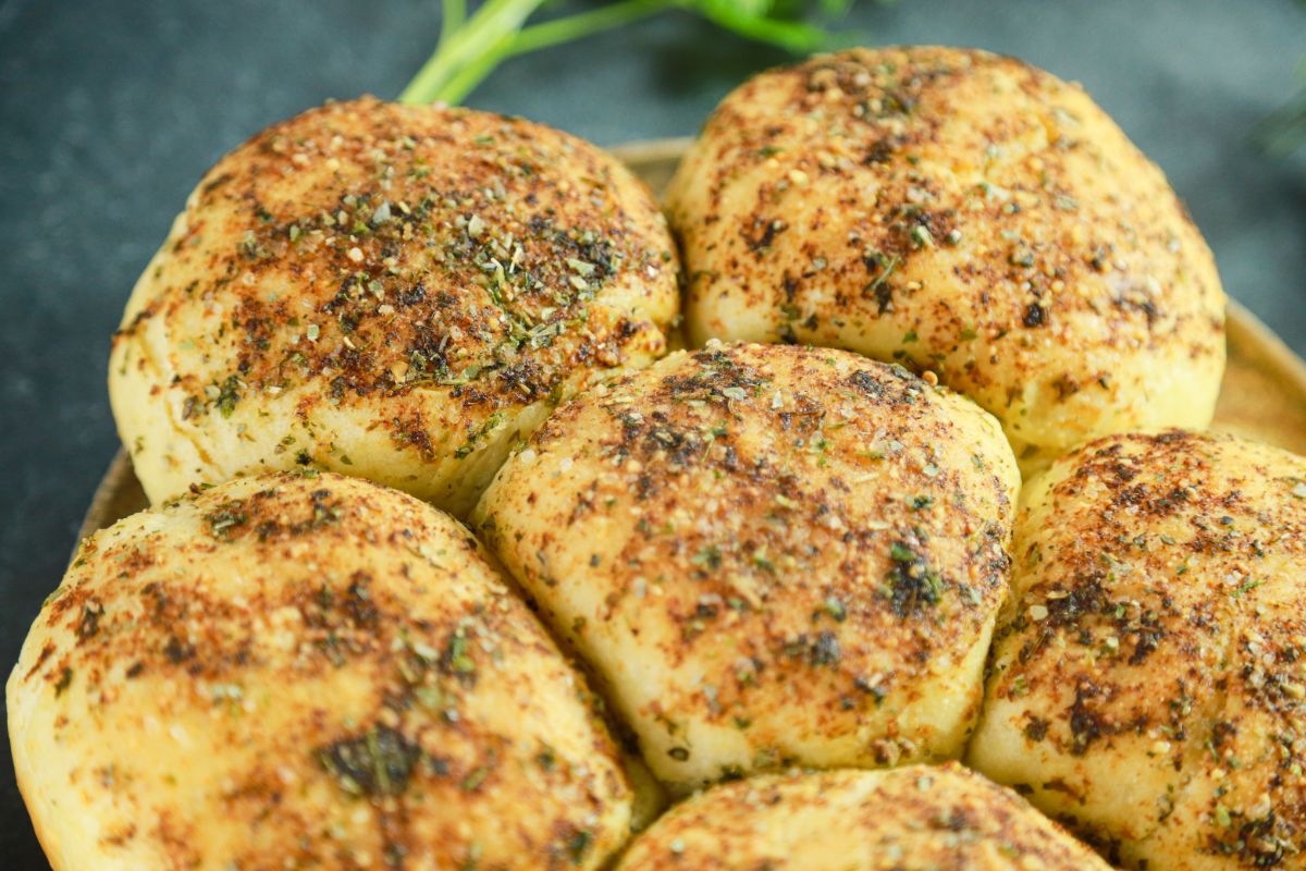 golden tops of bread rounds with herbs
