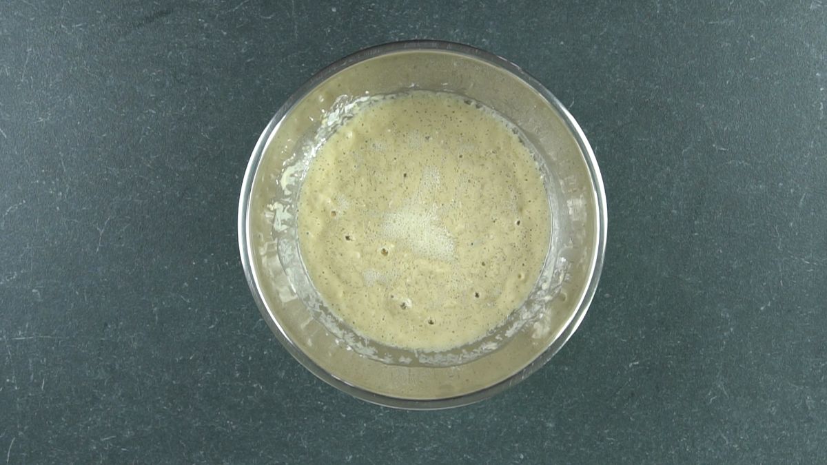 yeast and water mixture in silver bowl