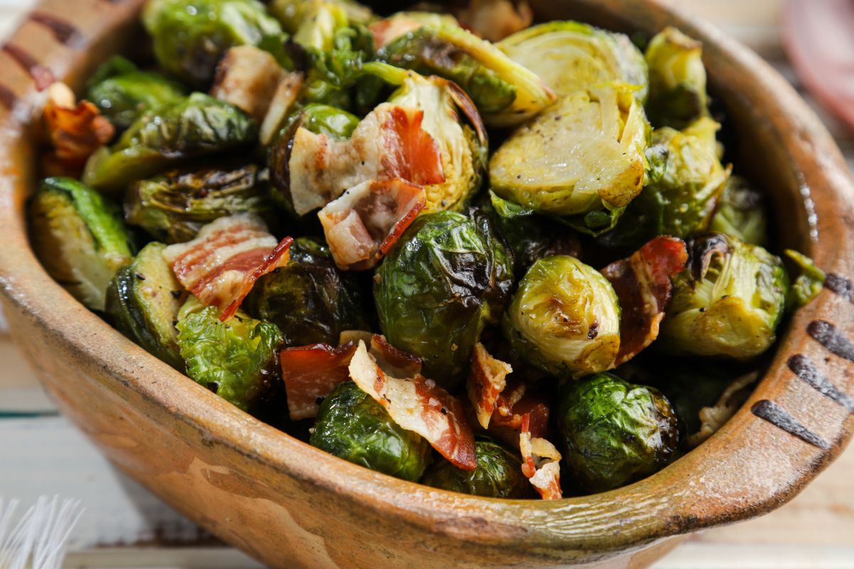 close up image of brussels sprouts in brown bowl