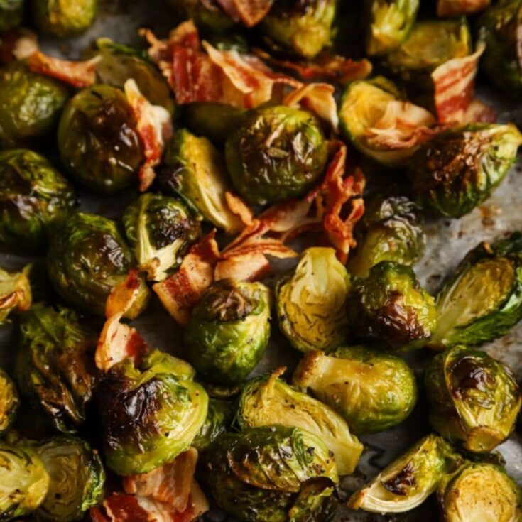 close up image of cooked brussels sprouts with bacon pieces