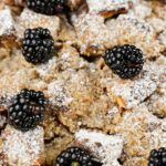 close up image of french toast bake with blackberries