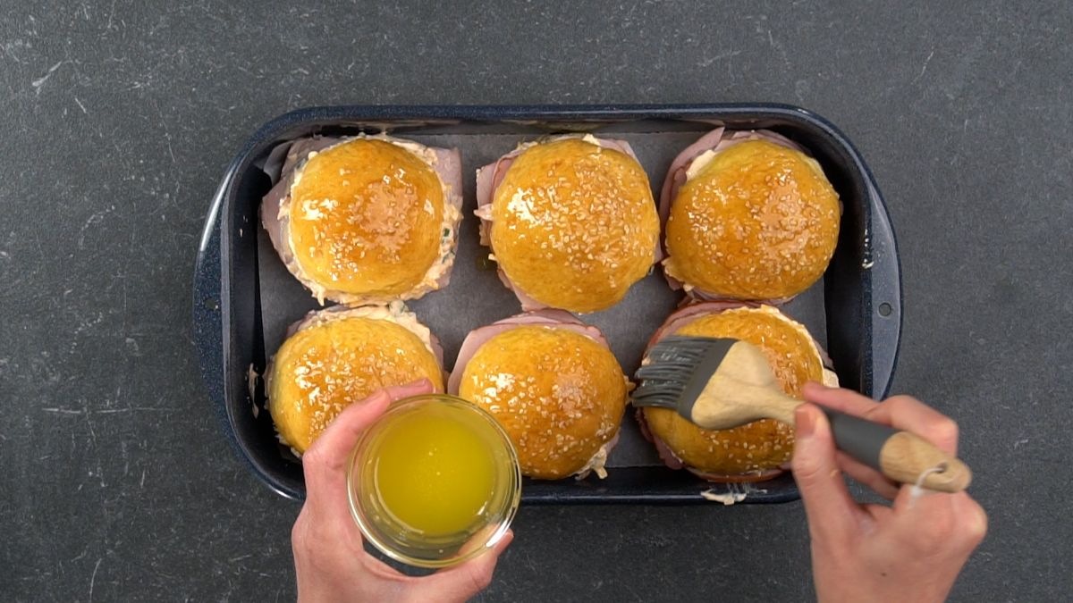 pastry brush coating sandwiches in butter