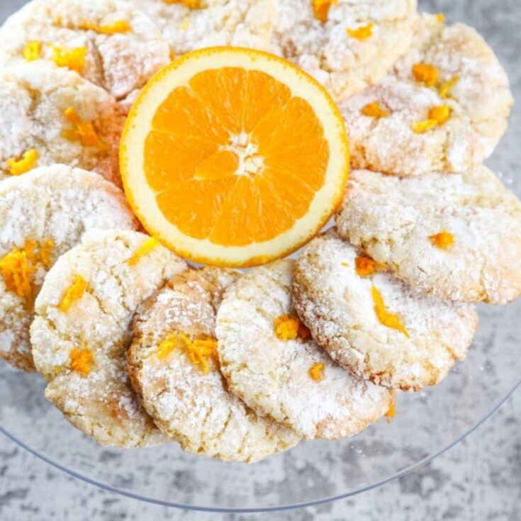 platter of Italian almond orange cookies with orange slice in center