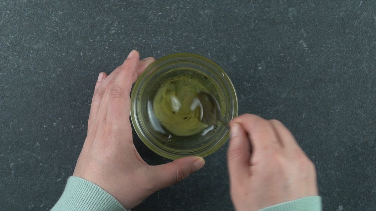 mixing oil and lemon juie in small glass bowl