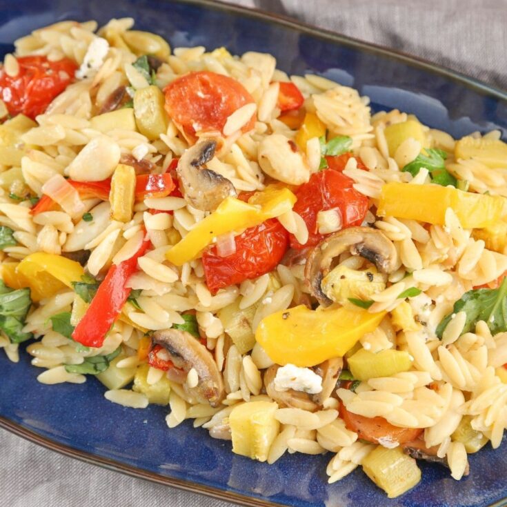 blue bowl of orzo with vegetables